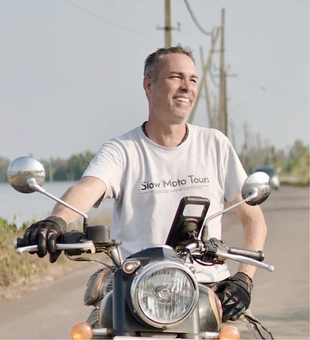 Jo, co-founder of Slow Moto Tours, on a Royal Enfield in South India